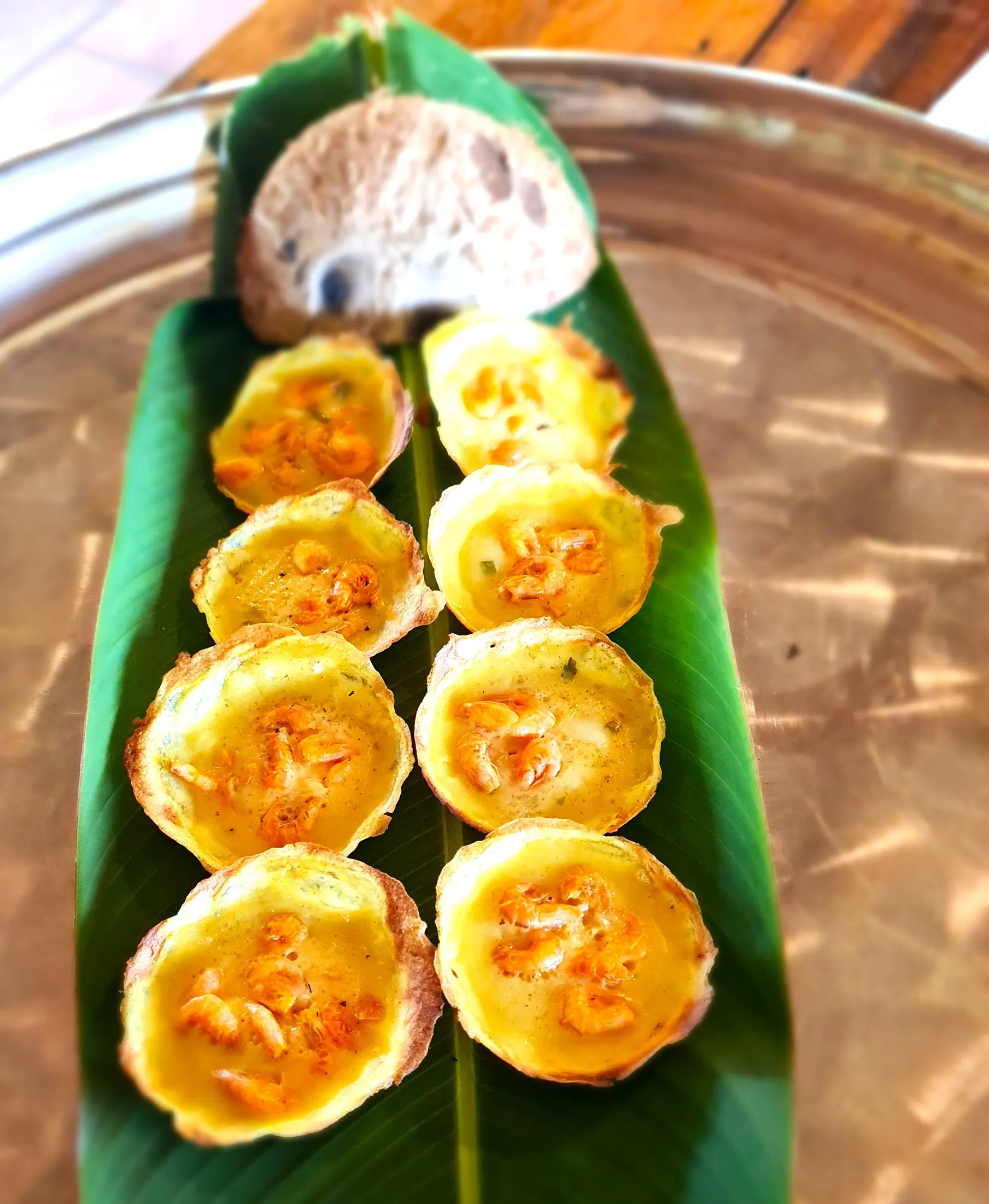 Small Vietnamese savoury pancakes served with greens