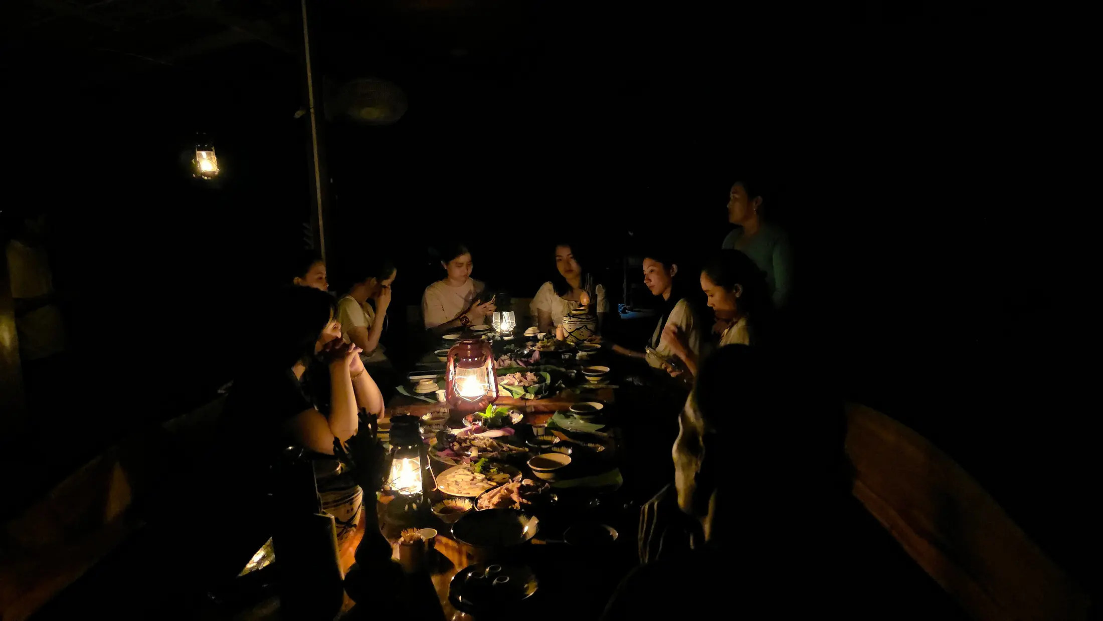 A softly lit dinner shared at Việt Mekong Farmstay
