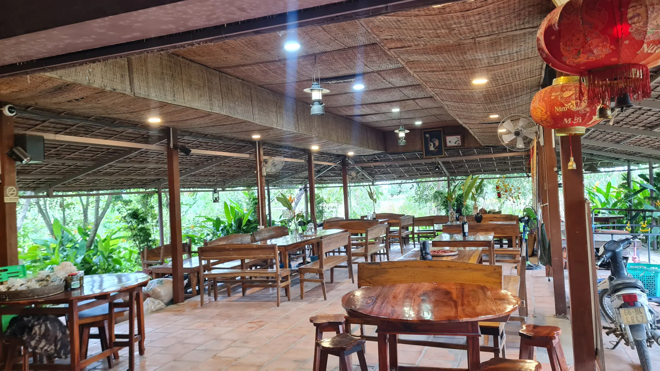 The rustic farmstay dining room lit with red lanterns