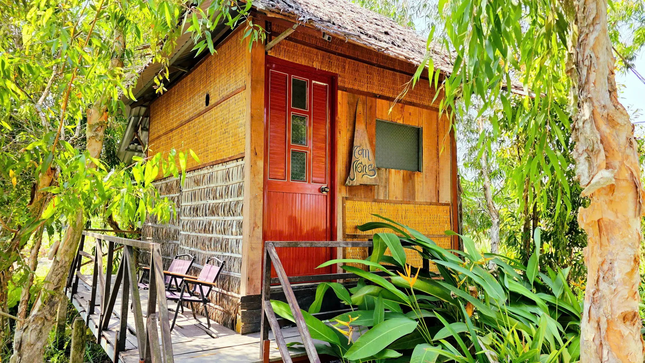Private bungalow exterior with a red door
